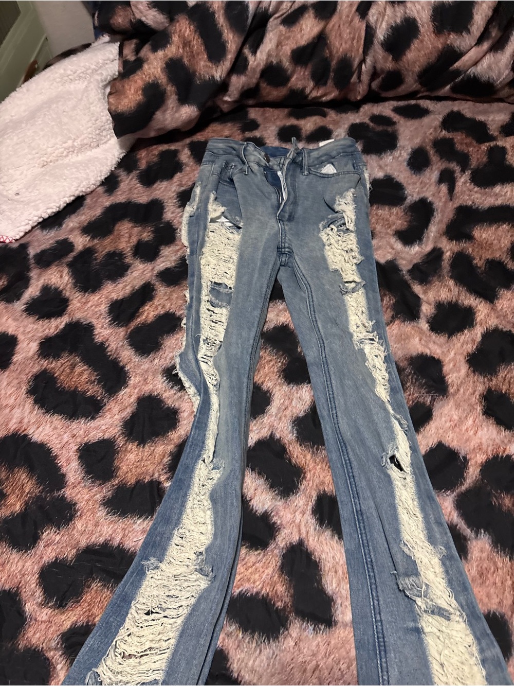 Ripped Blue Flare Jeans with Distressed Panels
